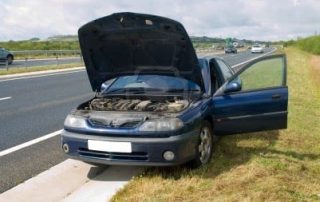Broken down car on side of road